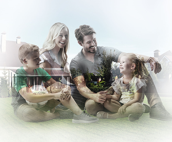 A family sitting on the ground