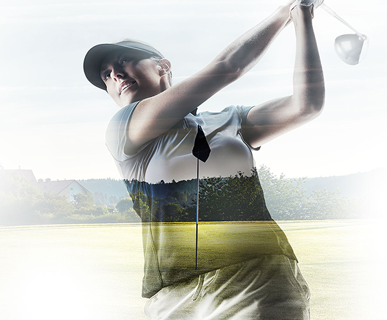 A woman swinging a golf club
